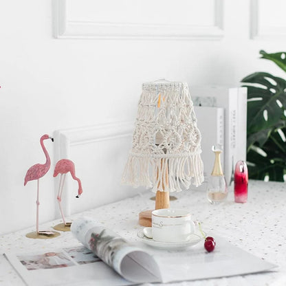 Boho macramé table lamp on a white table