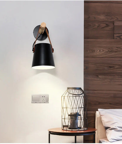 Scandinavian wall lamp with wooden arm in a bedroom