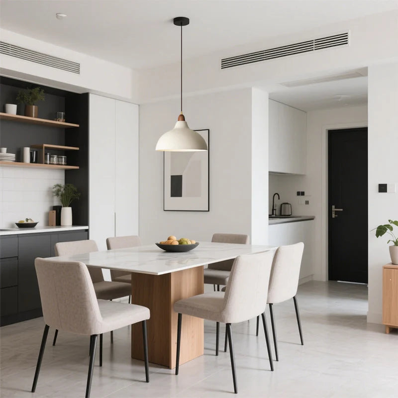 White dome pendant light above a dining table
